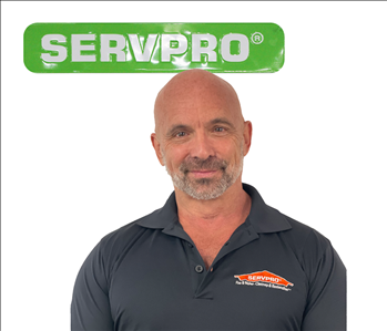 David, SERVPRO employee, green sign
