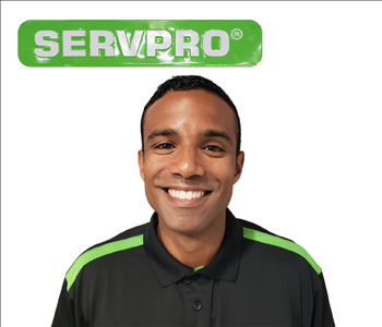 Eddie Urbina for SERVPRO photo in uniform; male employee with dark hair