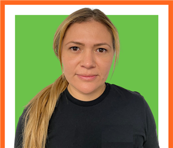 Female profile photo, against green background