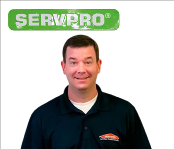 Brian Bell, SERVPRO employee on a white wall