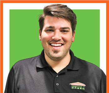 Gavin Parchman for SERVPRO photo on white wall