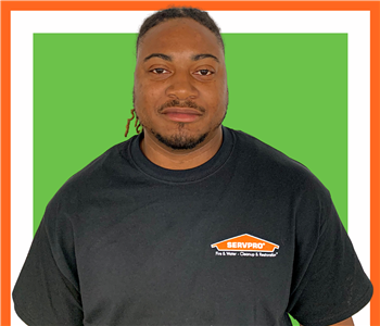 clifford for SERVPRO photo in uniform; male employee with dark hair 