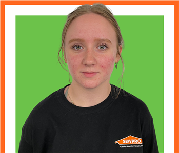 alerika, servpro employee against a green background, woman